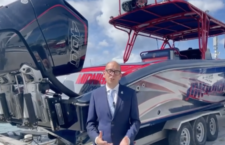 Governor Daniel Pruce in front of the vessel that was carrying the 1.8 tonnes of cocaine.